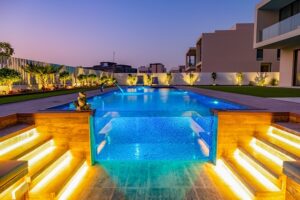 Key factors to consider before building a swimming pool in Dubai, including villa pool design, approvals, and construction planning